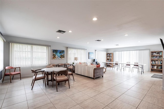 dining space with light tile patterned floors, visible vents, and recessed lighting