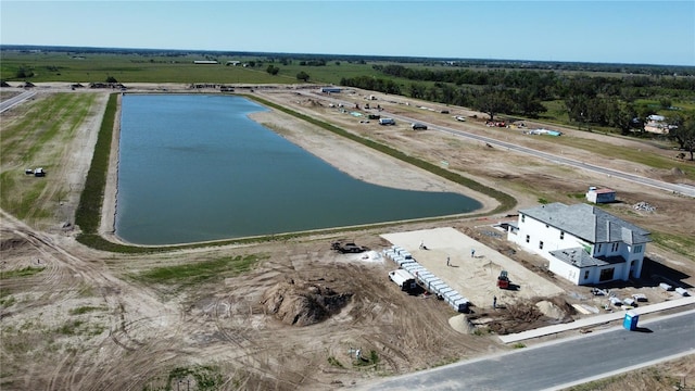 aerial view featuring a rural view and a water view