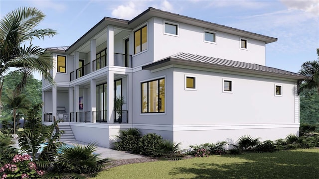 view of property exterior with stucco siding, metal roof, stairway, and a standing seam roof