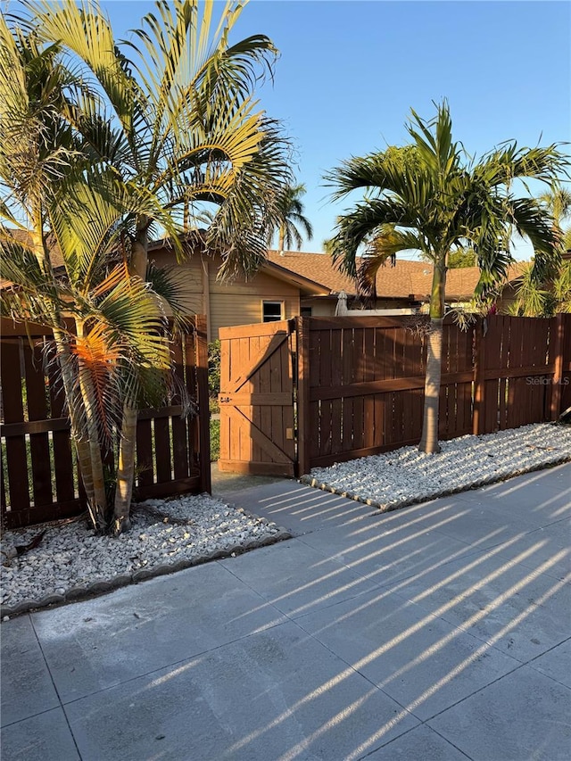 view of gate featuring fence