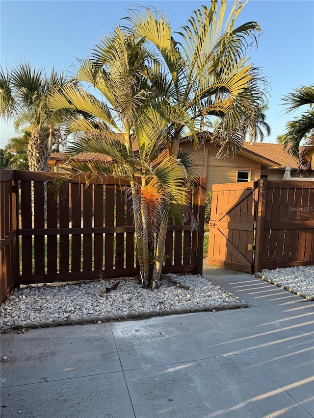 view of gate featuring fence