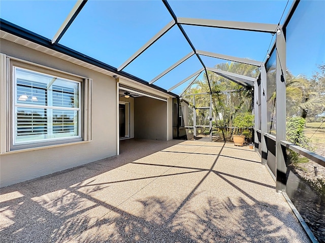 unfurnished sunroom featuring a healthy amount of sunlight and lofted ceiling