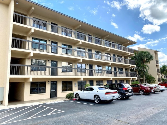 view of property with uncovered parking