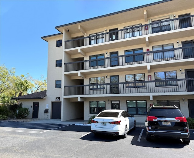 view of property with uncovered parking