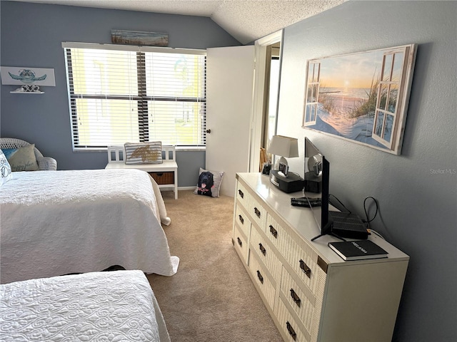 bedroom with light colored carpet, a textured ceiling, and lofted ceiling