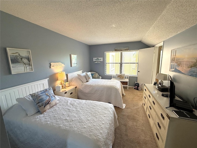 bedroom with carpet flooring, a textured ceiling, and lofted ceiling