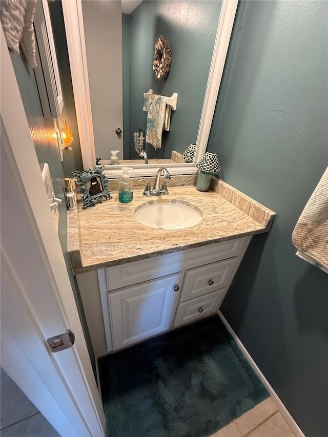 bathroom with tile patterned flooring and vanity