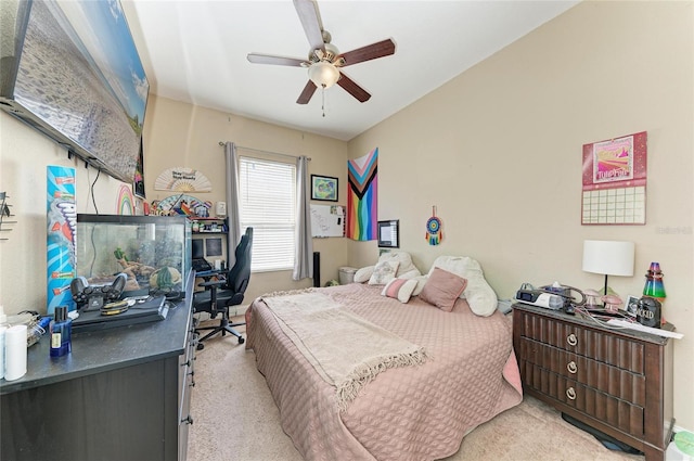 bedroom with ceiling fan and light carpet