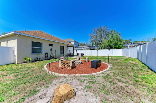 view of yard with a garden and a fenced backyard