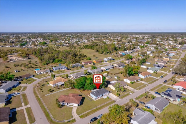 birds eye view of property with a residential view