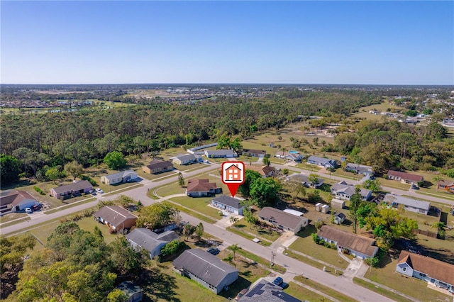 drone / aerial view featuring a view of trees