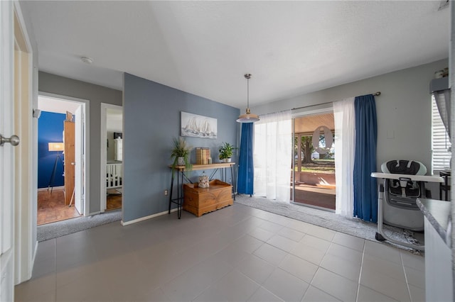 dining area with tile patterned flooring and baseboards