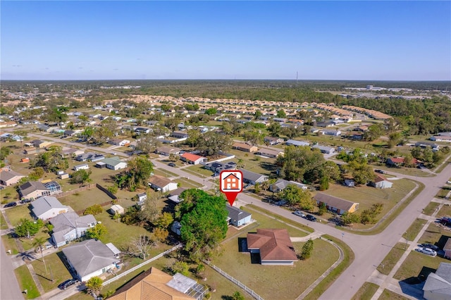 birds eye view of property with a residential view