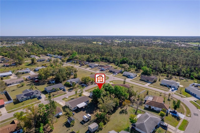 bird's eye view featuring a residential view and a view of trees