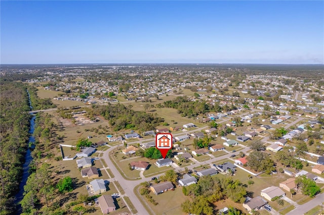 birds eye view of property with a residential view