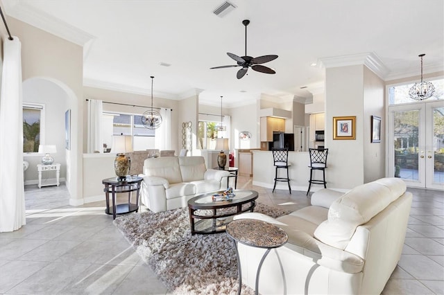 living room with light tile patterned floors, french doors, visible vents, and ornamental molding