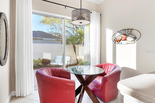 dining area with light tile patterned flooring and baseboards