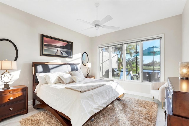 bedroom with baseboards and a ceiling fan