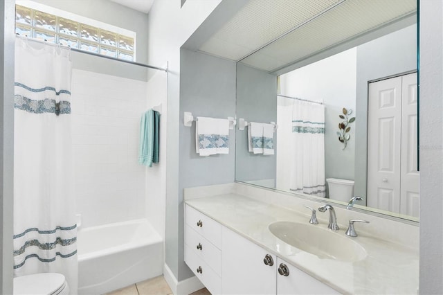 bathroom featuring tile patterned flooring, shower / bathtub combination with curtain, toilet, and vanity