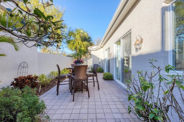 view of patio / terrace with a fenced backyard and outdoor dining space