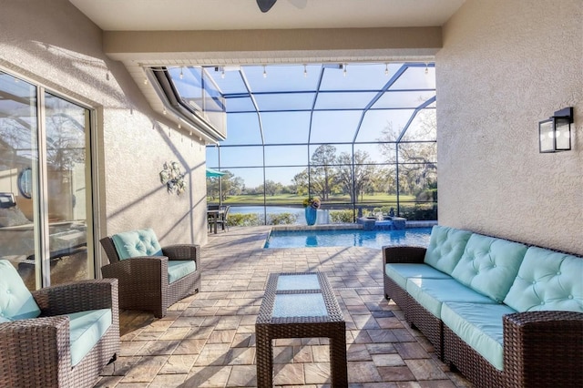 view of patio / terrace with a lanai, an outdoor pool, outdoor lounge area, and a water view