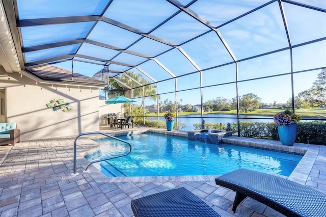 view of pool featuring a patio area, a pool with connected hot tub, a lanai, and a water view