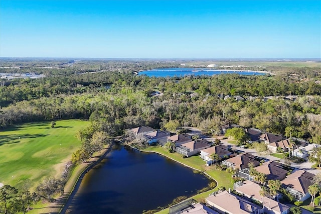 birds eye view of property featuring a residential view, a wooded view, and a water view