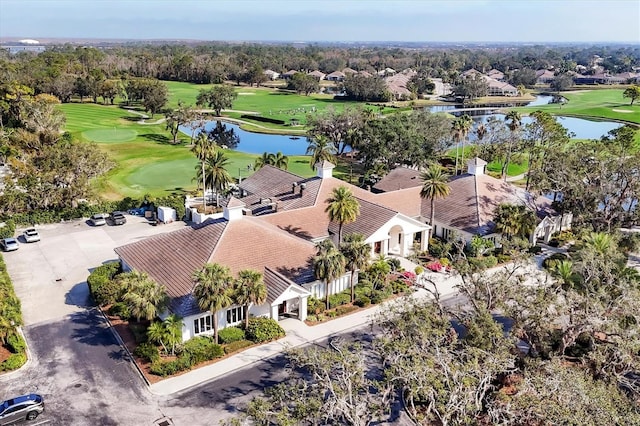 bird's eye view featuring a water view and view of golf course