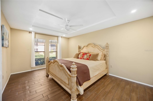 2347 Beneva Ter Unit 2251, Sarasota, FL 34232 - bedroom with wood finished floors, a ceiling fan, a tray ceiling, and baseboards