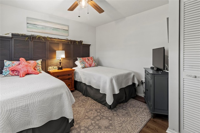 bedroom with wood finished floors, a closet, and ceiling fan