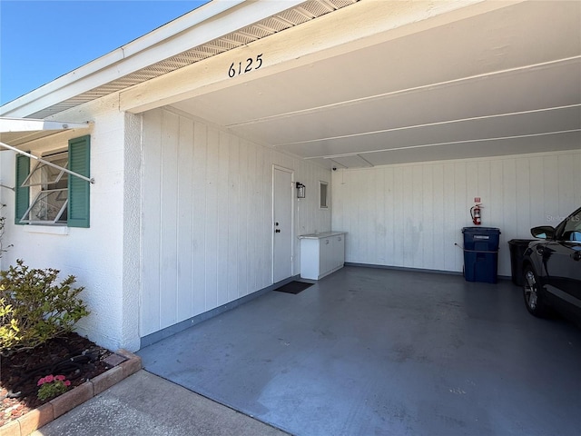 garage featuring an attached carport