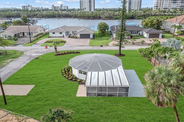 birds eye view of property featuring a city view and a water view