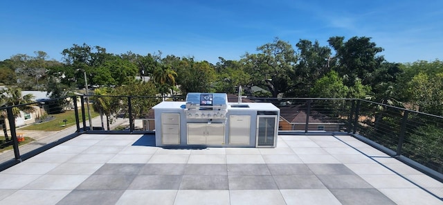 view of patio with a balcony and grilling area