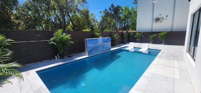 view of swimming pool with a fenced in pool, a patio, and a fenced backyard