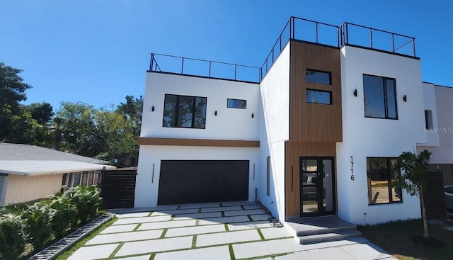 contemporary home featuring an attached garage and stucco siding