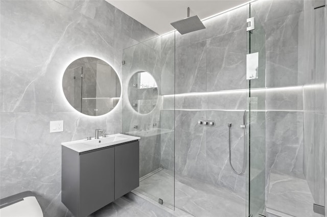 1716 9th St, Sarasota, FL 34236 - full bath with a marble finish shower, vanity, and tile walls
