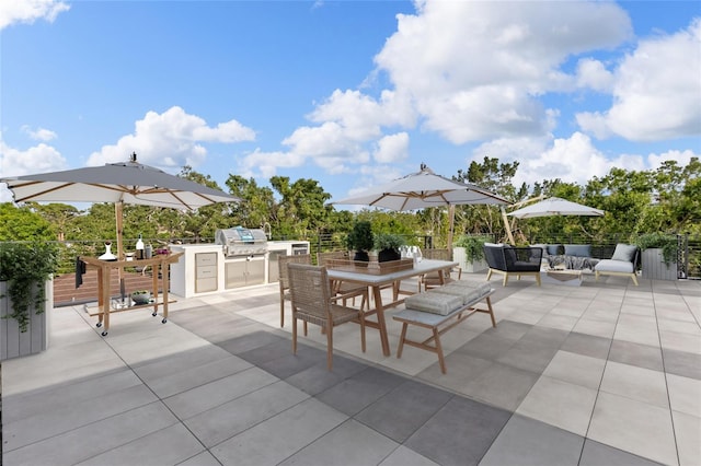 1716 9th St, Sarasota, FL 34236 - view of patio / terrace featuring a grill, outdoor dining space, an outdoor hangout area, and an outdoor kitchen