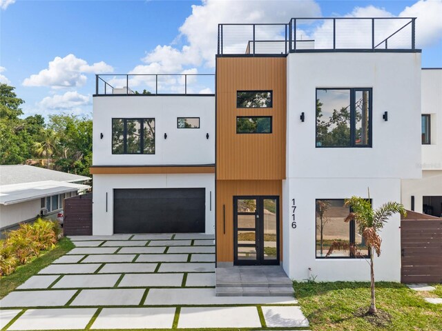 1716 9th St, Sarasota, FL 34236 - contemporary home featuring an attached garage, driveway, and stucco siding