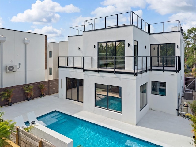 1716 9th St, Sarasota, FL 34236 - rear view of house featuring a patio area, stucco siding, a balcony, and an outdoor pool