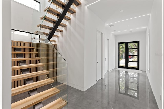 1716 9th St, Sarasota, FL 34236 - foyer with stairs, baseboards, visible vents, and french doors