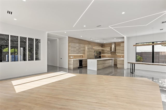 1716 9th St, Sarasota, FL 34236 - unfurnished living room featuring visible vents, recessed lighting, wine cooler, and a fireplace