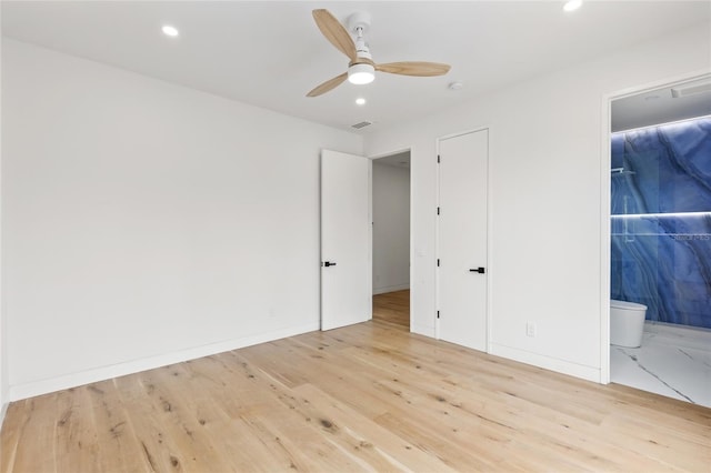 1716 9th St, Sarasota, FL 34236 - unfurnished bedroom featuring recessed lighting, wood finished floors, and connected bathroom