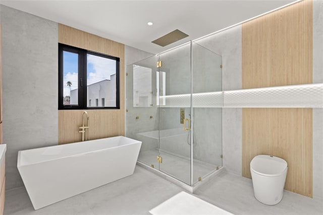 1716 9th St, Sarasota, FL 34236 - bathroom featuring a freestanding tub, a stall shower, and toilet