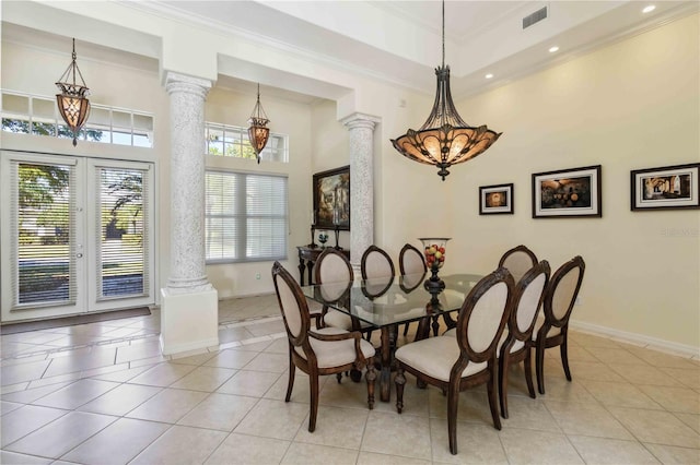 dining space with light tile patterned floors, baseboards, ornate columns, ornamental molding, and french doors