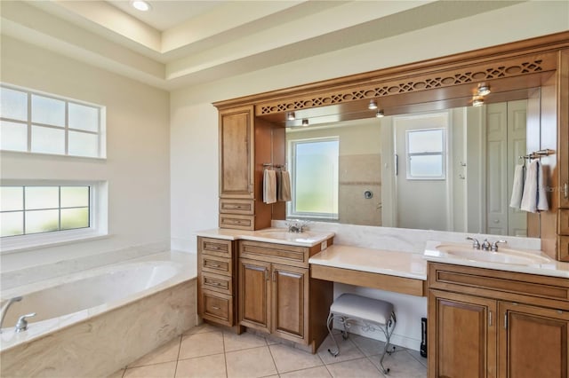 bathroom featuring vanity, tile patterned floors, a bath, and a walk in shower