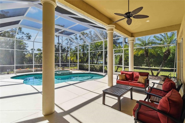 view of pool featuring an outdoor living space, a pool with connected hot tub, ceiling fan, glass enclosure, and a patio