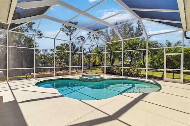 view of pool with a lanai, a patio area, and a pool with connected hot tub