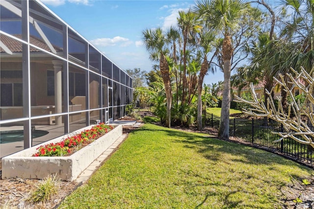 view of yard with a lanai, a fenced in pool, and fence