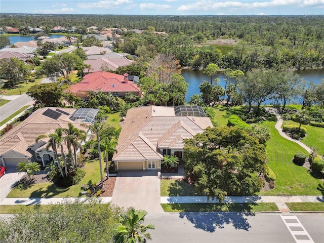 bird's eye view with a forest view and a water view