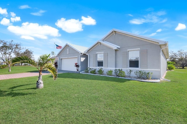 view of front facade with stucco siding, driveway, a front lawn, and a garage